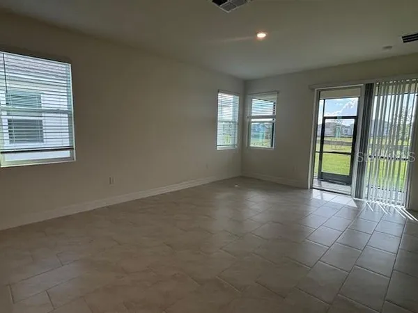 a view of a livingroom with a hard wood floor and window