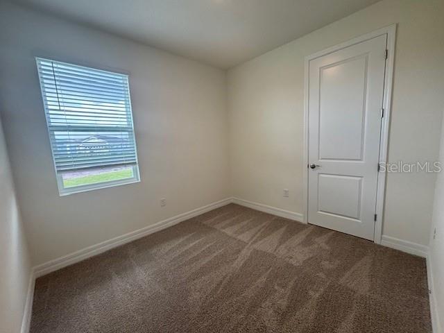 3975 Kennebunk Loop Mount Dora, FL 32757 - Photo 9 of 13 an empty room with a window