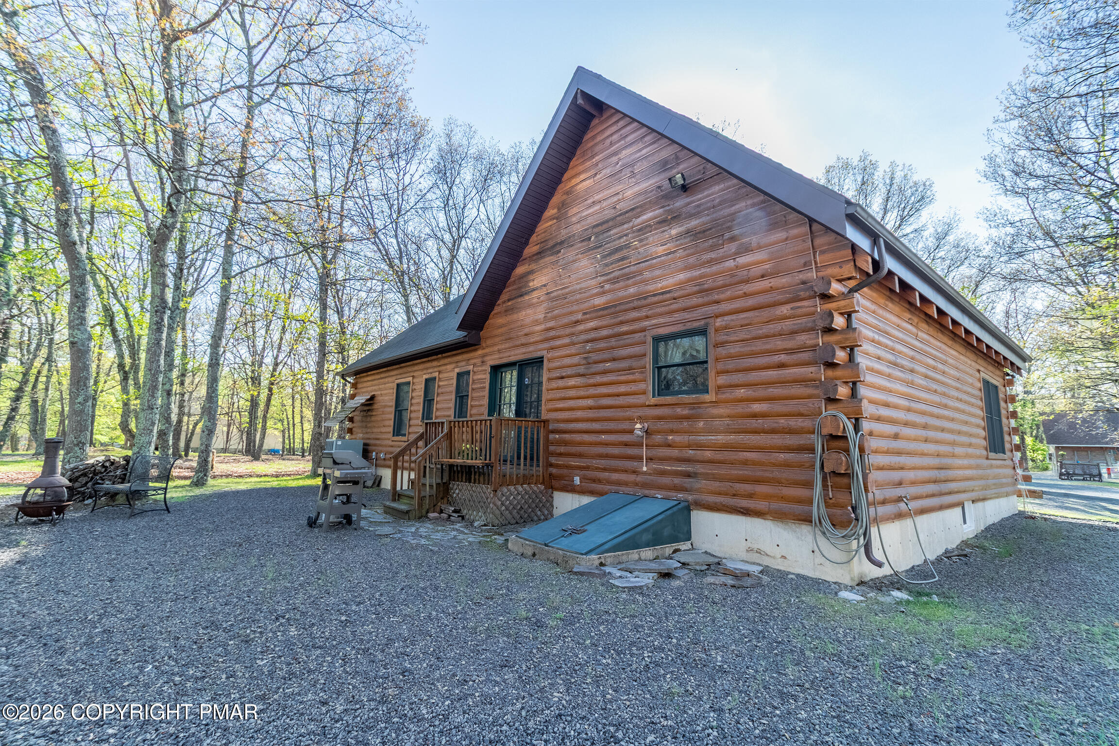 1160 Bluebird Lane Bushkill, PA 18324 - Photo 41 of 44 a view of a house with a yard and wooden fence