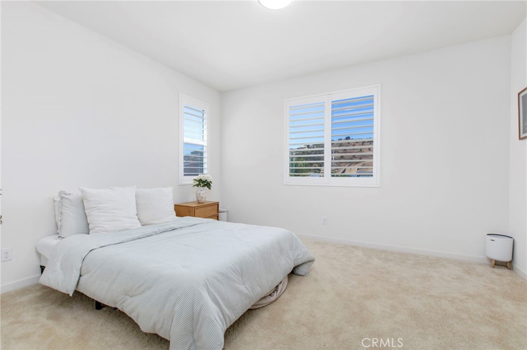 32797 Hayden Road Menifee, CA 92584 - Photo 28 of 51 a bedroom with a bed and a window