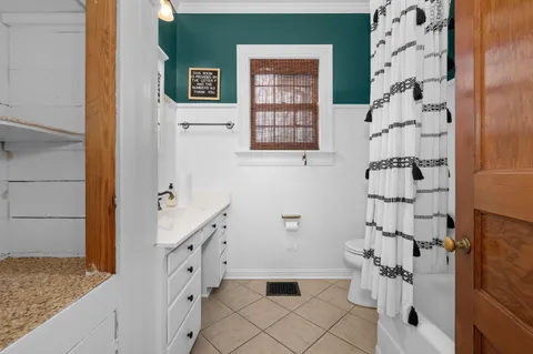 a bathroom with a bathtub sink and toilet