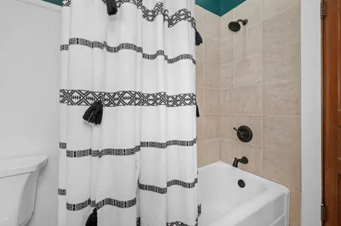 a bathroom with a sink and shower