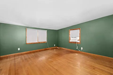 a view of a room with a fan and a window