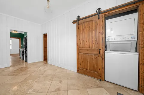 a view of a storage & utility room with closet