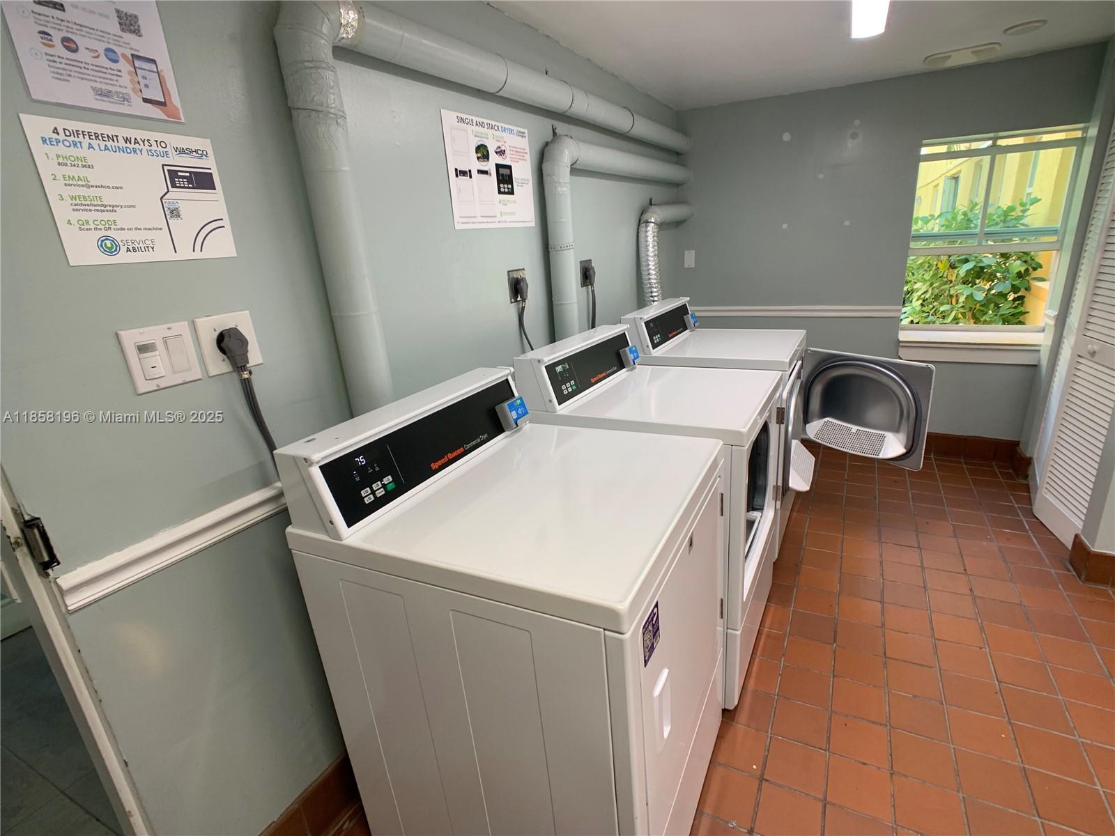 1308 Drexel Avenue, Unit 105 Miami Beach, FL 33139 - Photo 5 of 24 a utility room with dryer and washer