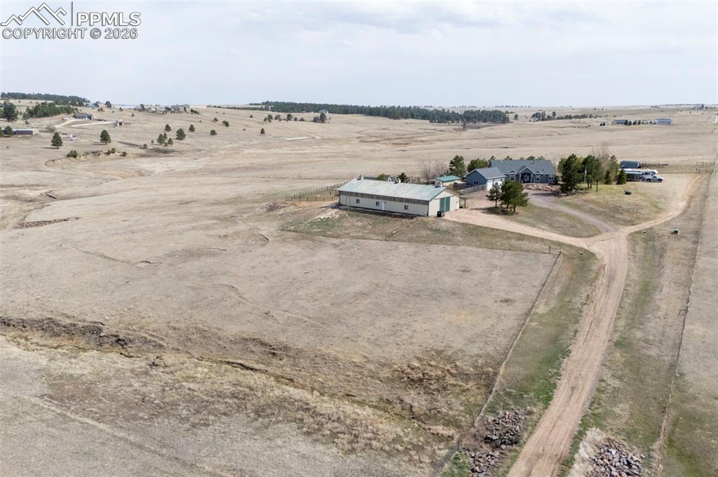 5910 McCart Ranch Circle Elizabeth, CO 80107 - Photo 47 of 50 a view of a lake with beach