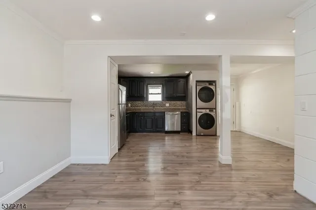 a view of a kitchen with a sink and a stove top oven