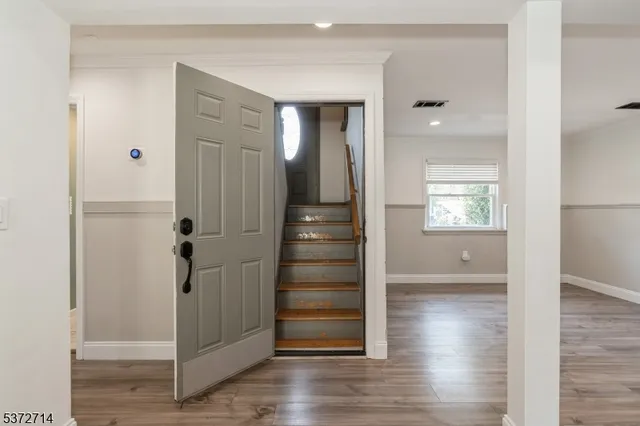 a view of entryway with wooden floor
