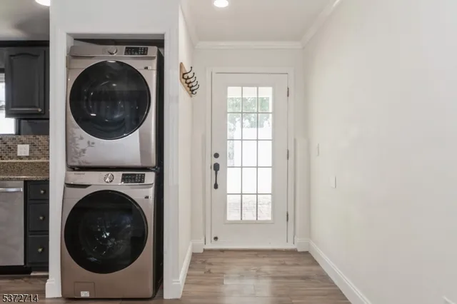 a view of a hallway with washer and dryer