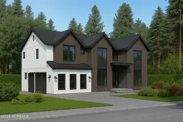 a front view of a house with a yard and trees