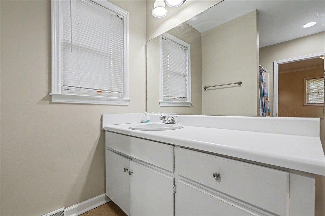 798 Coneross Creek Road Seneca, SC 29678 - Photo 17 of 34 This bathroom features a functional vanity with a sleek countertop and practical storage.