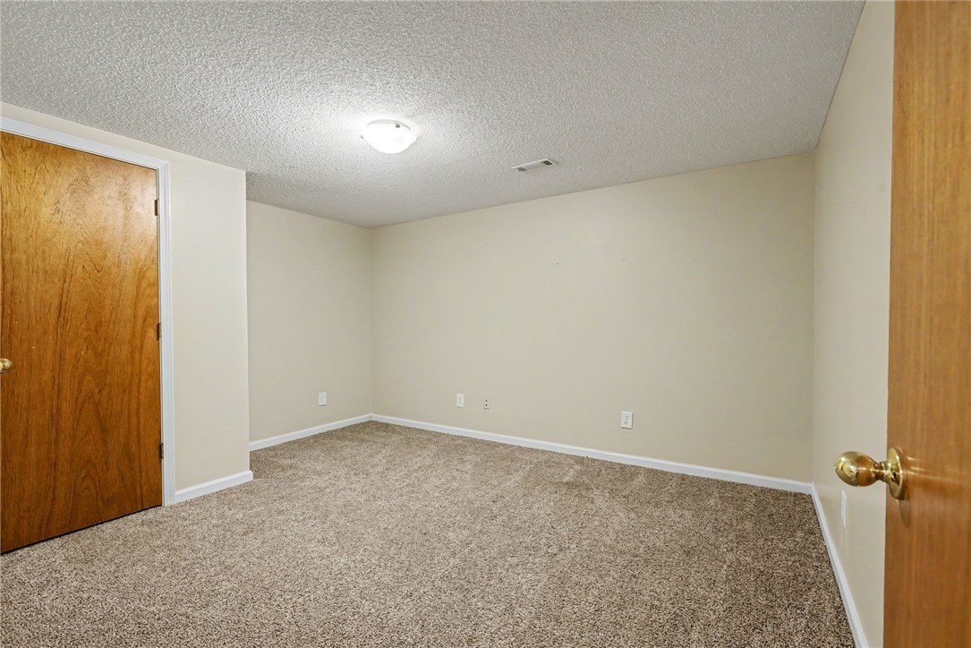 798 Coneross Creek Road Seneca, SC 29678 - Photo 20 of 34 This spacious room offers plush carpeting and ample wall space for personalization.
