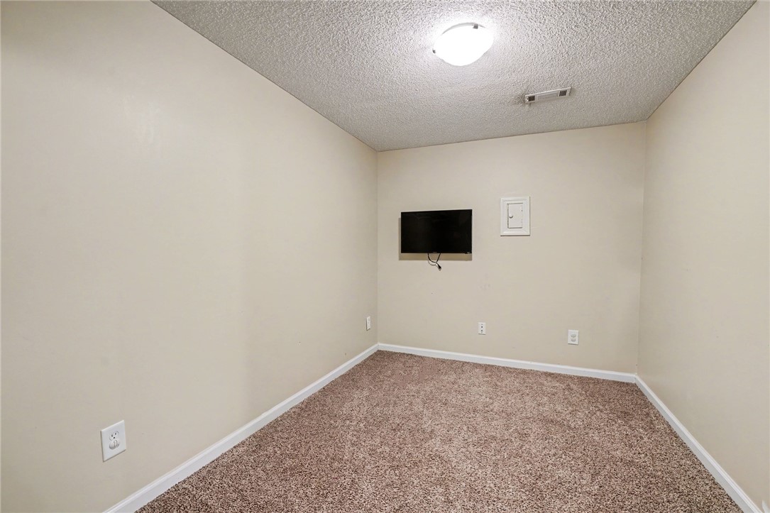 798 Coneross Creek Road Seneca, SC 29678 - Photo 21 of 34 This cozy space features plush carpeting and a bright ceiling light, perfect for a private retreat.