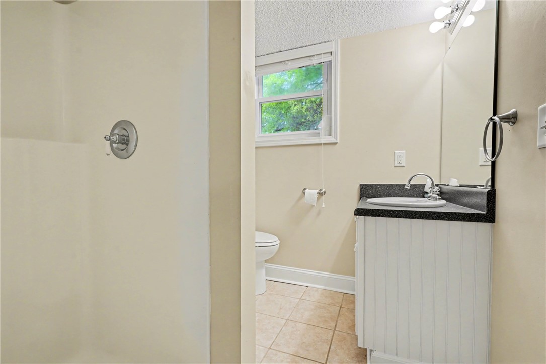 798 Coneross Creek Road Seneca, SC 29678 - Photo 24 of 34 This functional bathroom features a shower, a single vanity, and tiled flooring.