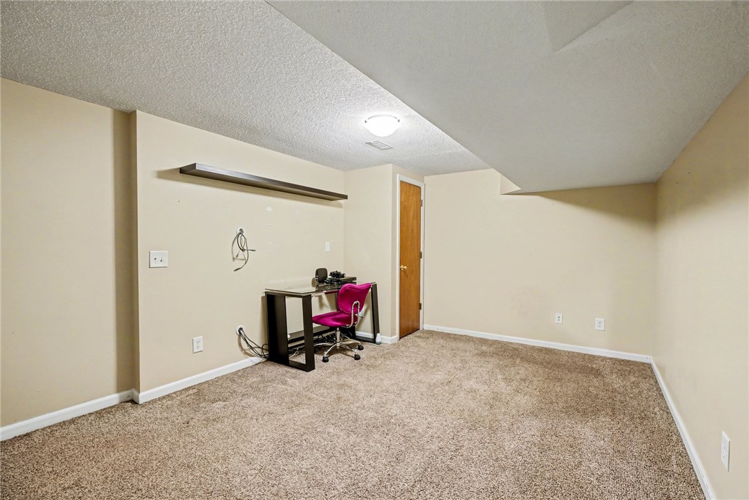 798 Coneross Creek Road Seneca, SC 29678 - Photo 25 of 34 This versatile basement space offers an ideal setting for a home office or recreation area.