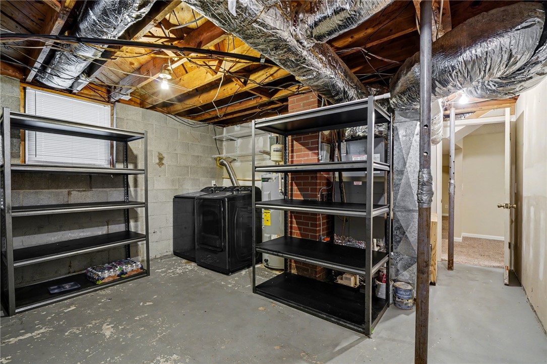 798 Coneross Creek Road Seneca, SC 29678 - Photo 28 of 34 This basement offers practical storage solutions and essential utility hookups.