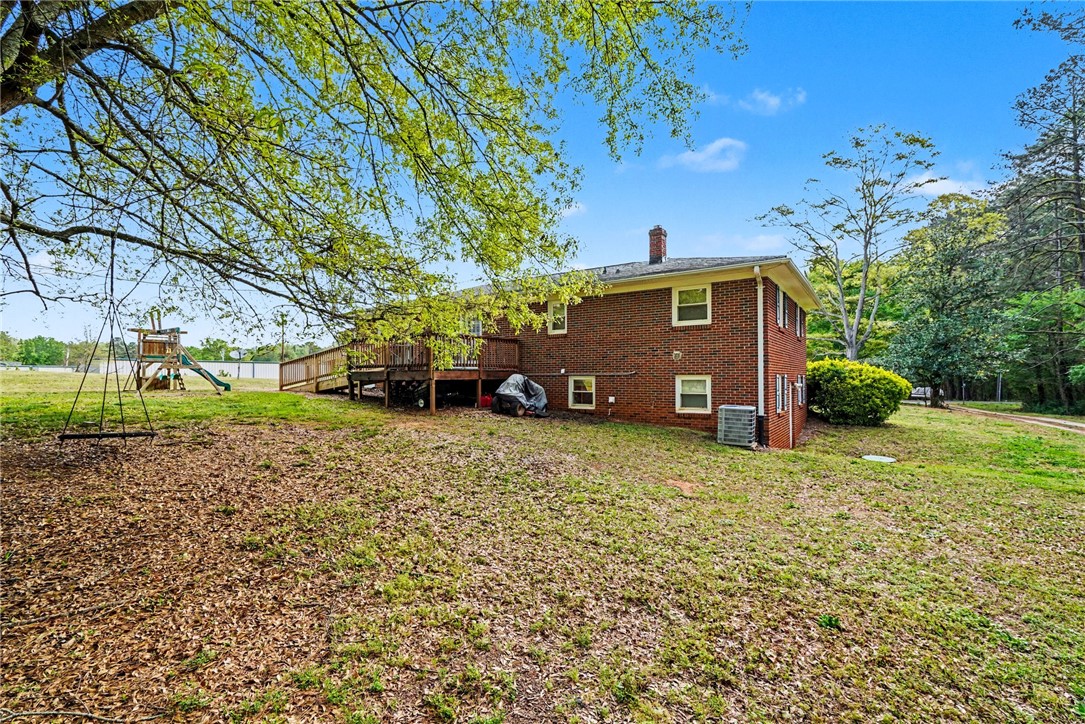 798 Coneross Creek Road Seneca, SC 29678 - Photo 31 of 34 This expansive backyard offers a perfect setting for relaxation and outdoor enjoyment.