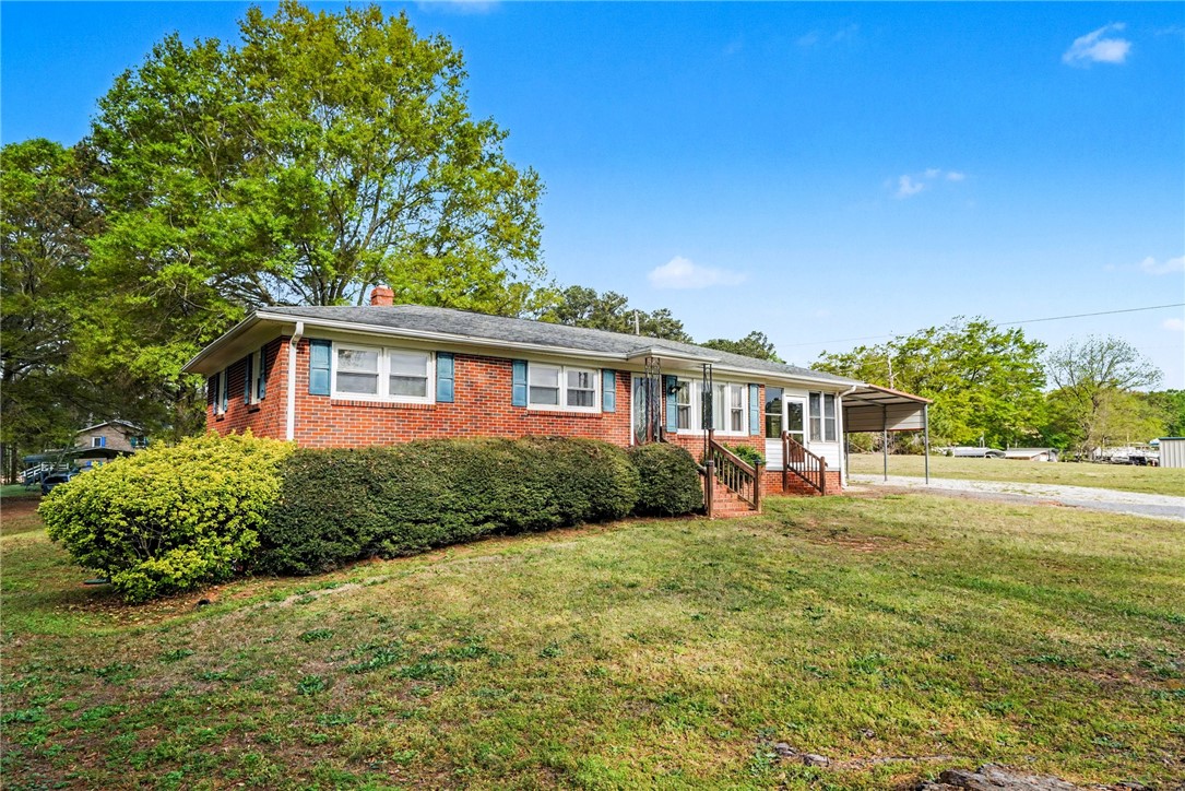 798 Coneross Creek Road Seneca, SC 29678 - Photo 5 of 34 This classic brick ranch home features a welcoming porch, mature landscaping, and a convenient carport.