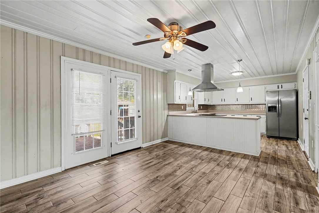 798 Coneross Creek Road Seneca, SC 29678 - Photo 10 of 34 This spacious kitchen and dining area features abundant natural light and seamless indoor-outdoor flow.