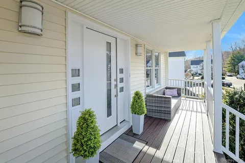 a view of a balcony with chairs