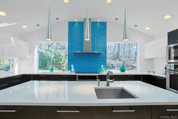 a kitchen with a sink and a window