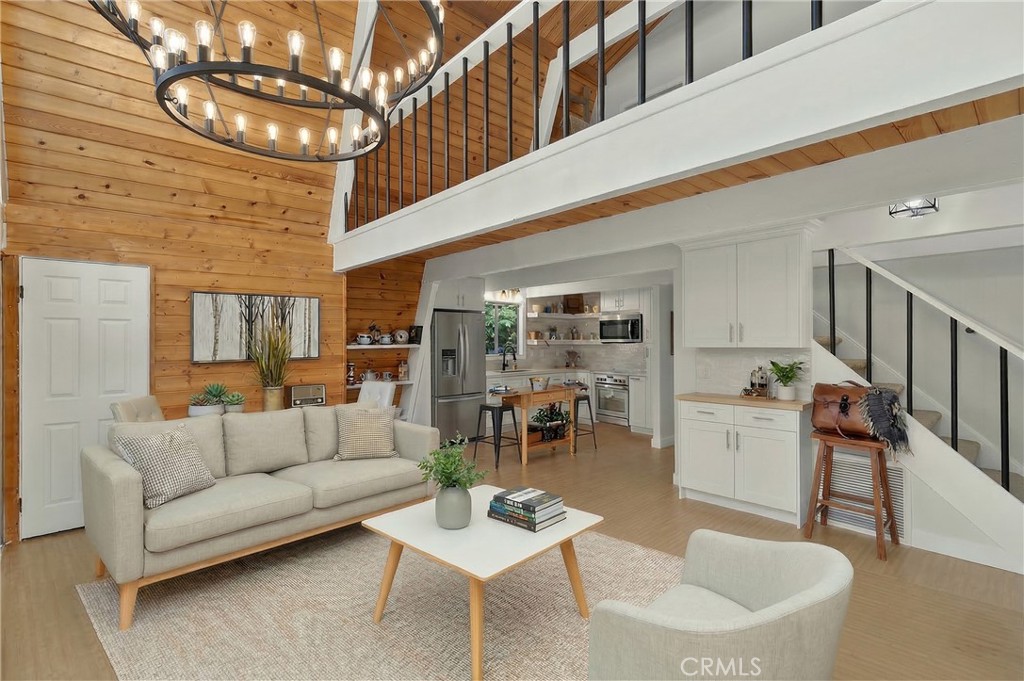 Virtually staged sofa, coffee table, chair, area rug.