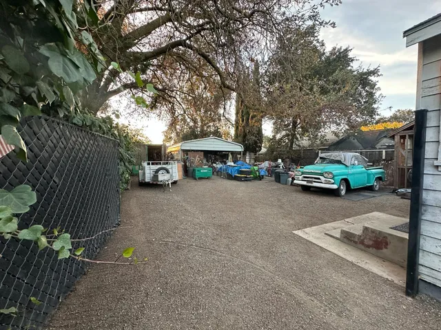 a view of street with parked cars