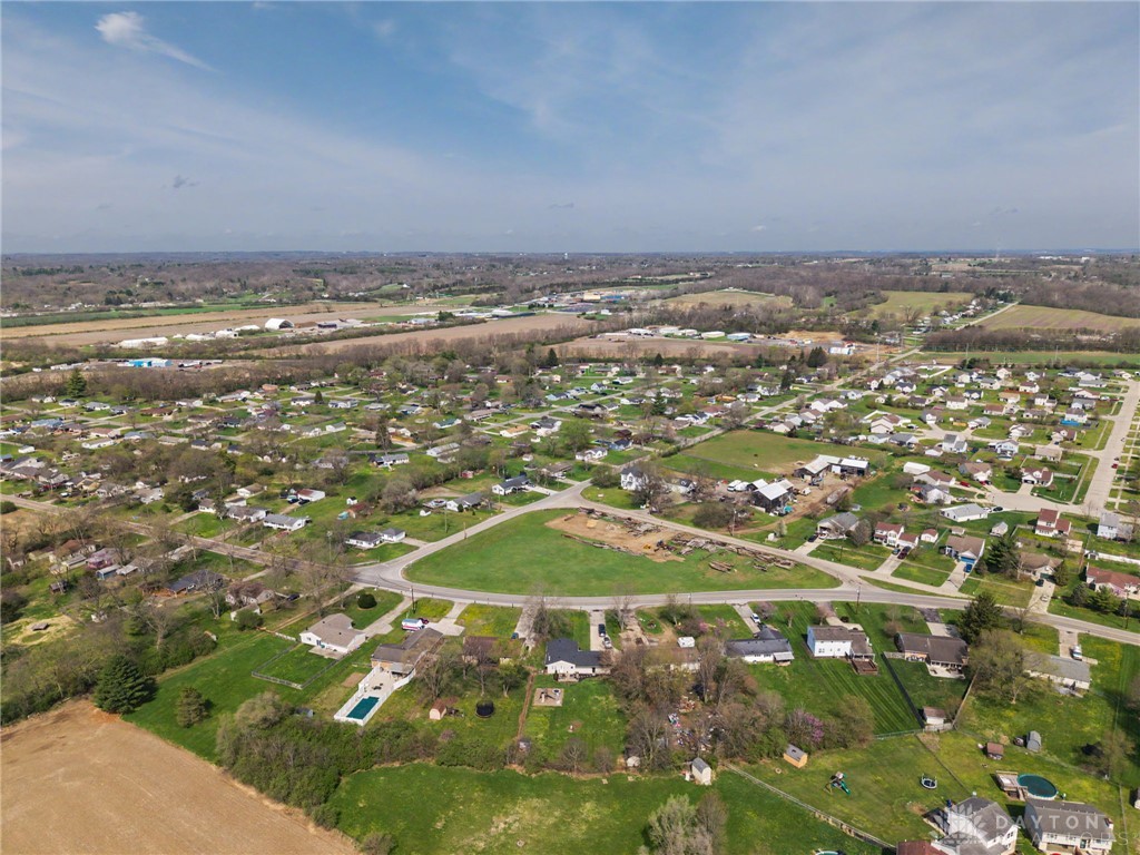 8969 Franklin-Trenton Road Franklin, OH 45005 - Photo 21 of 49 An aerial perspective reveals a vibrant neighborhood with homes nestled among green spaces and open fields.