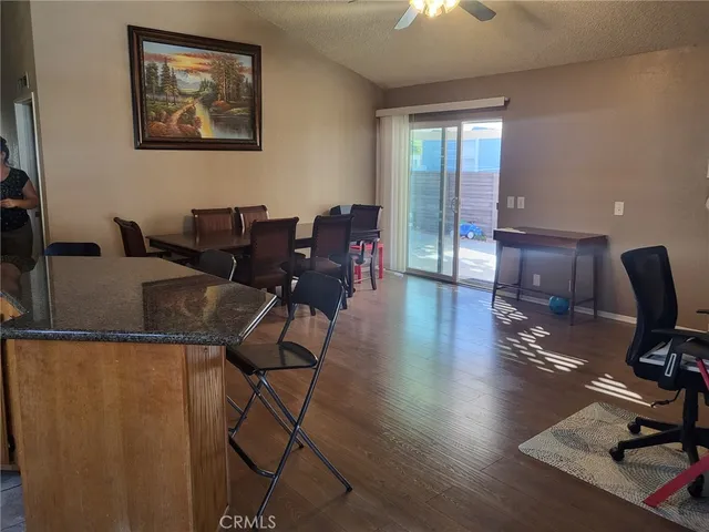 a view of a workspace with furniture and chandelier