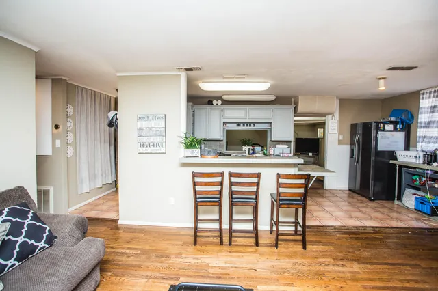 a kitchen with a table and chairs in it