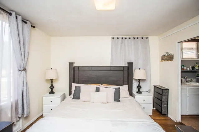 a large white bed in a white room