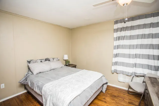 a bedroom with a bed and a walk in closet