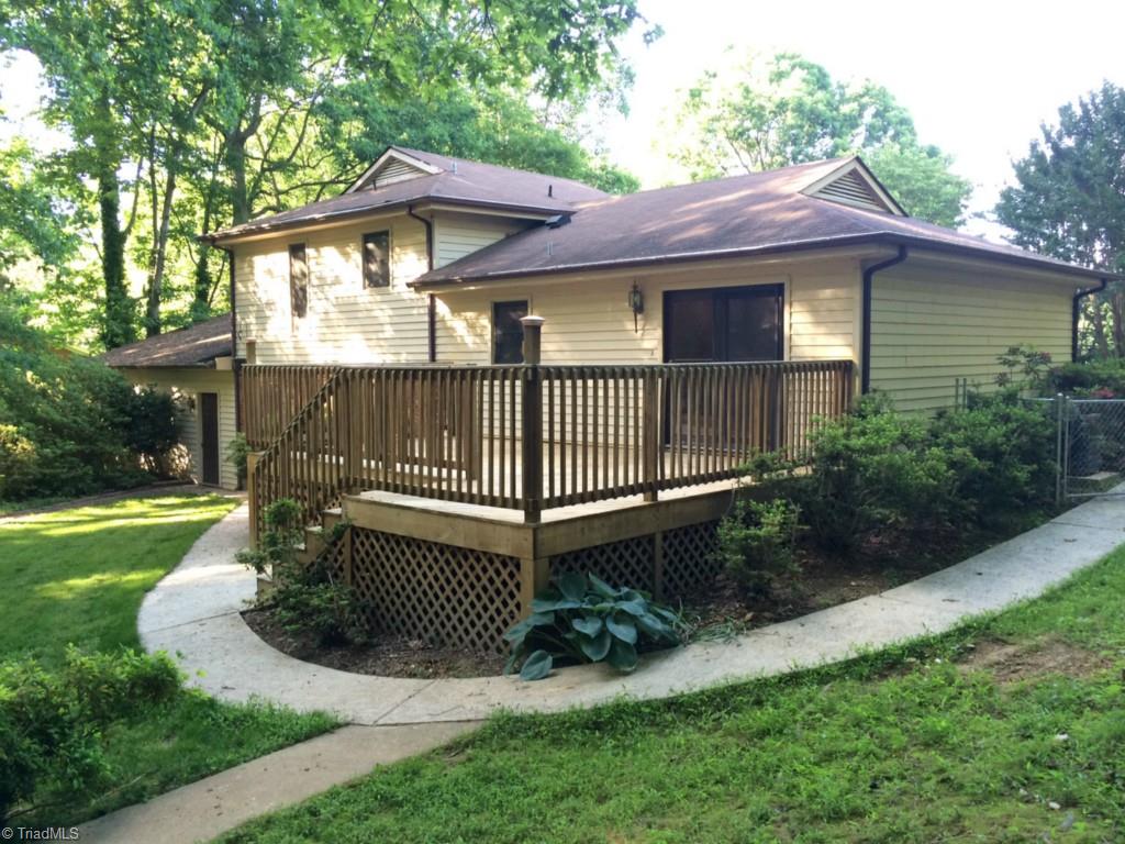 1001 Amity Road Asheboro, NC 27203 - Photo 2 of 10 Huge back deck, ready for entertaining, nice back yard with concrete walkway and outbuilding for storage.