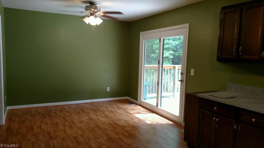 1001 Amity Road Asheboro, NC 27203 - Photo 8 of 10 Nice open dining room with access to the back deck.