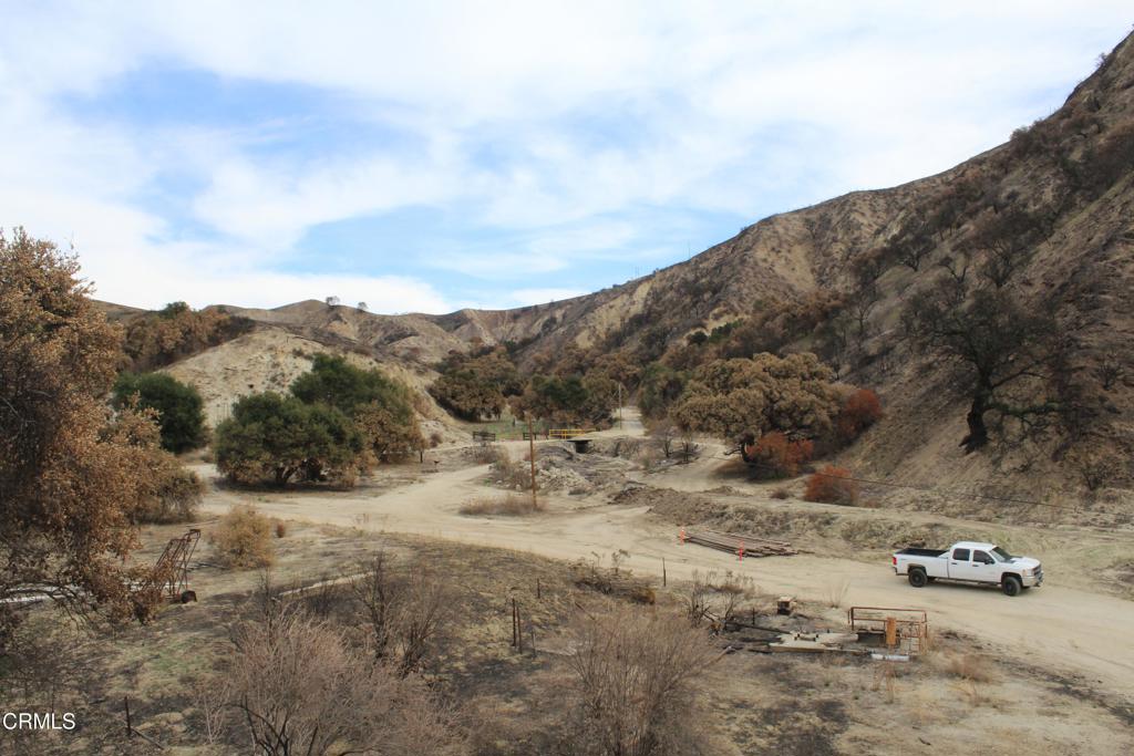 31029 Hasley Canyon Road Castaic, CA 91384 - Photo 7 of 25 a view of a dry yard with mountains in the background