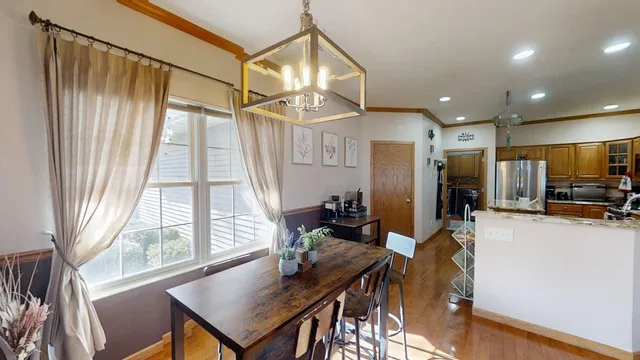 a view of a dining room with furniture window and outside view