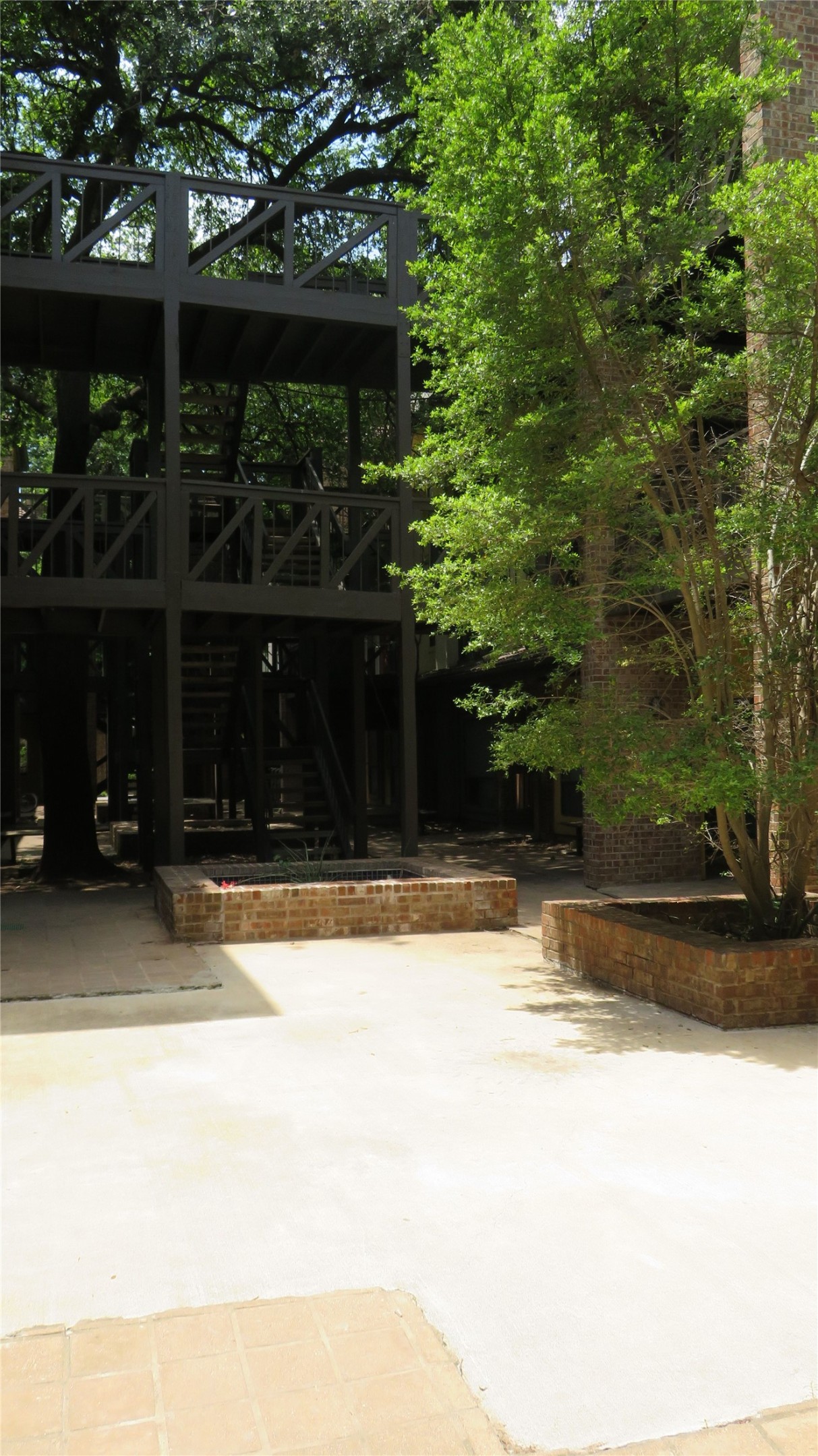 806 West 24th Street, Unit 200 Austin, TX 78705 - Photo 5 of 33 A multi-level outdoor structure with extensive decking provides unique arboreal living.