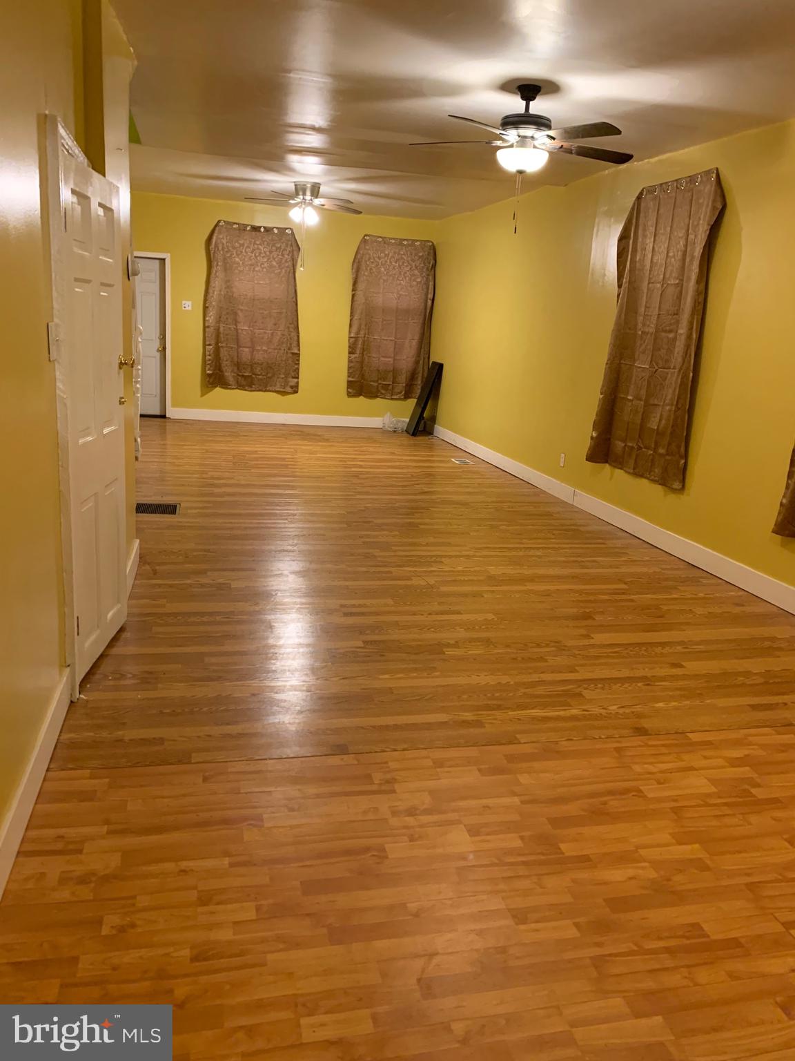 321 Highland Avenue Chester, PA 19013 - Photo 11 of 40 a view of a room with wooden floor