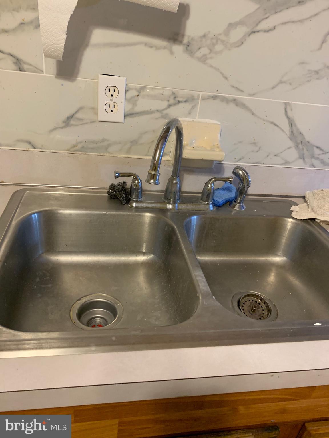 321 Highland Avenue Chester, PA 19013 - Photo 13 of 40 a close view of sink and tap