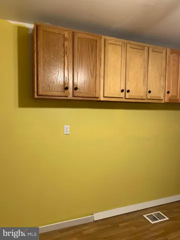 a white toilet sitting next to a shower