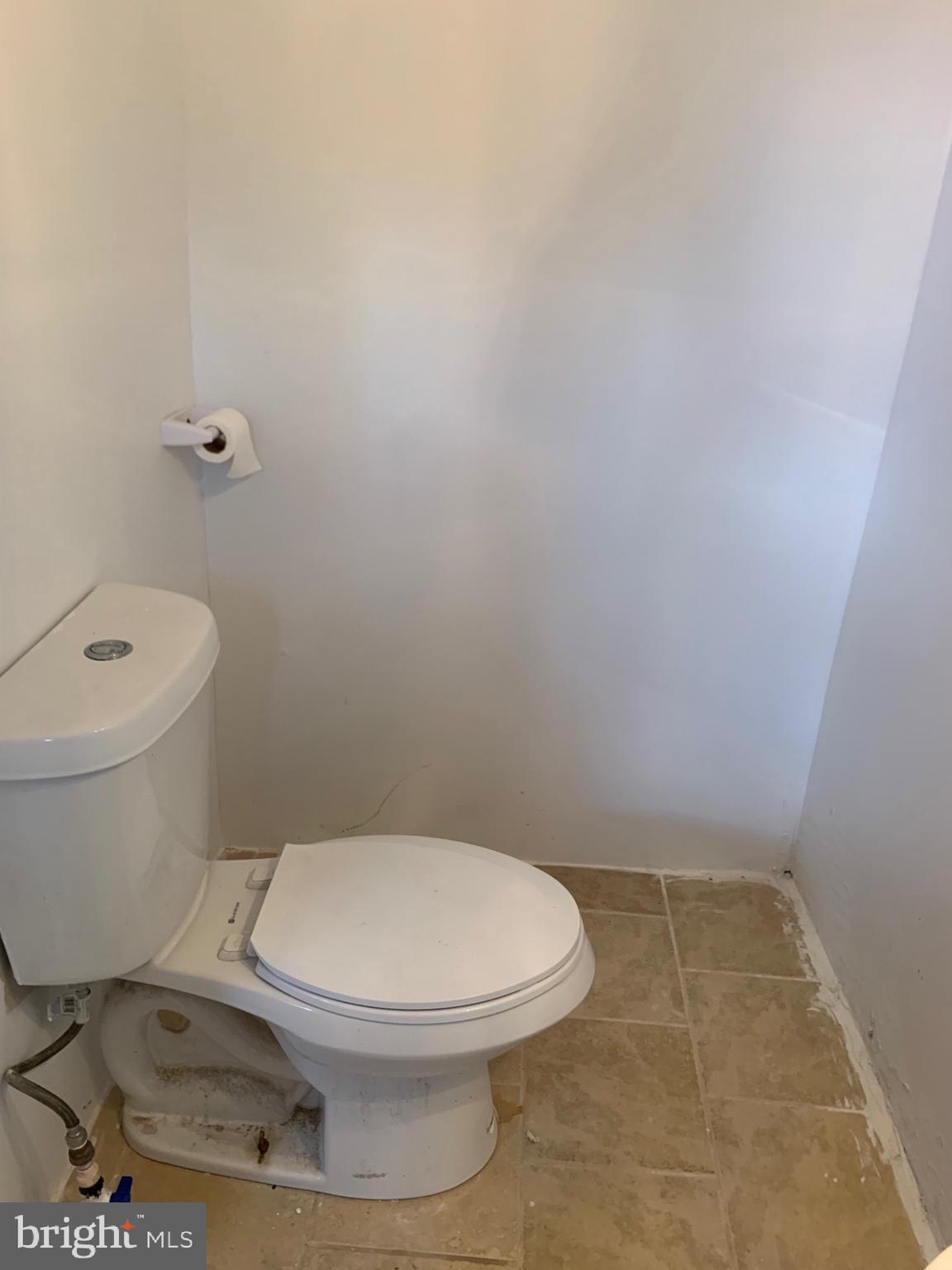 321 Highland Avenue Chester, PA 19013 - Photo 19 of 40 a white toilet sitting next to a shower