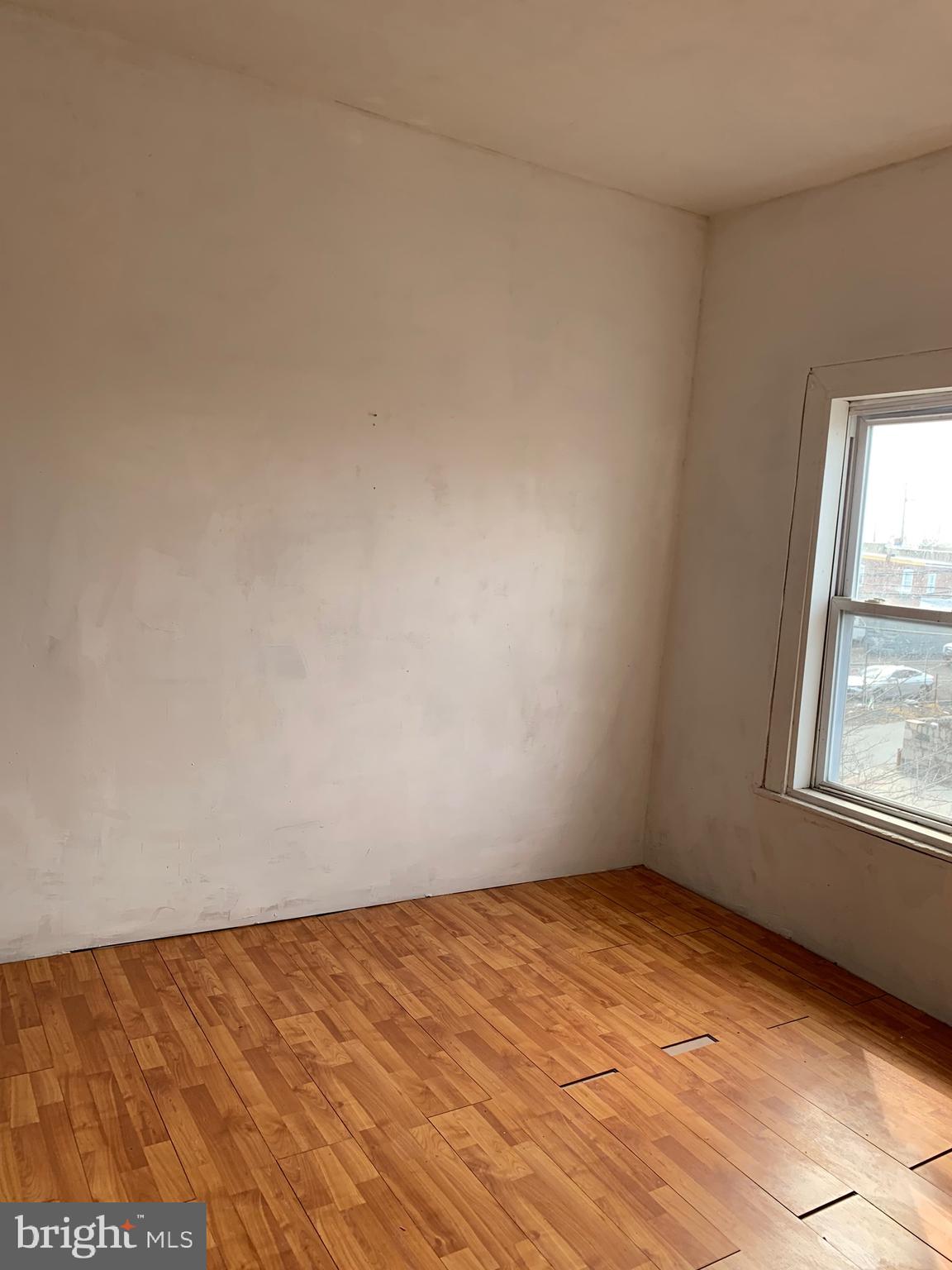 321 Highland Avenue Chester, PA 19013 - Photo 30 of 40 an empty room with a window