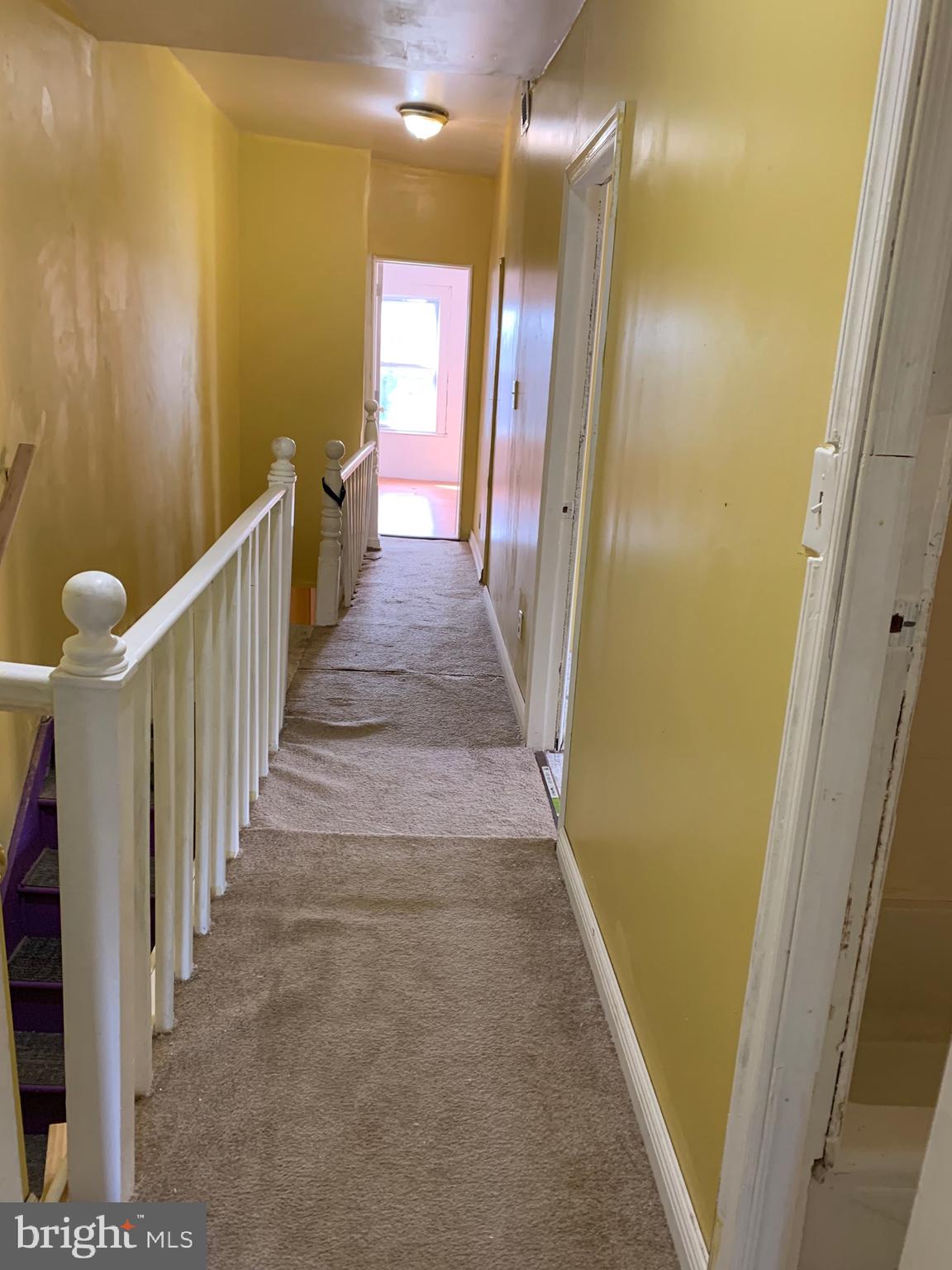 321 Highland Avenue Chester, PA 19013 - Photo 37 of 40 a view of a hallway with wooden floor