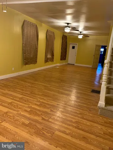a view of a house with wooden fence