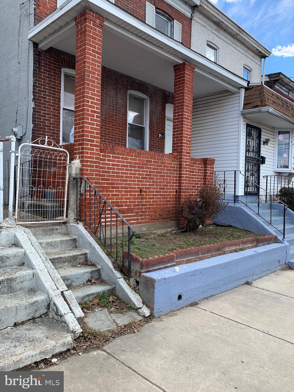 321 Highland Avenue Chester, PA 19013 - Photo 6 of 40 a view of a house with wooden fence