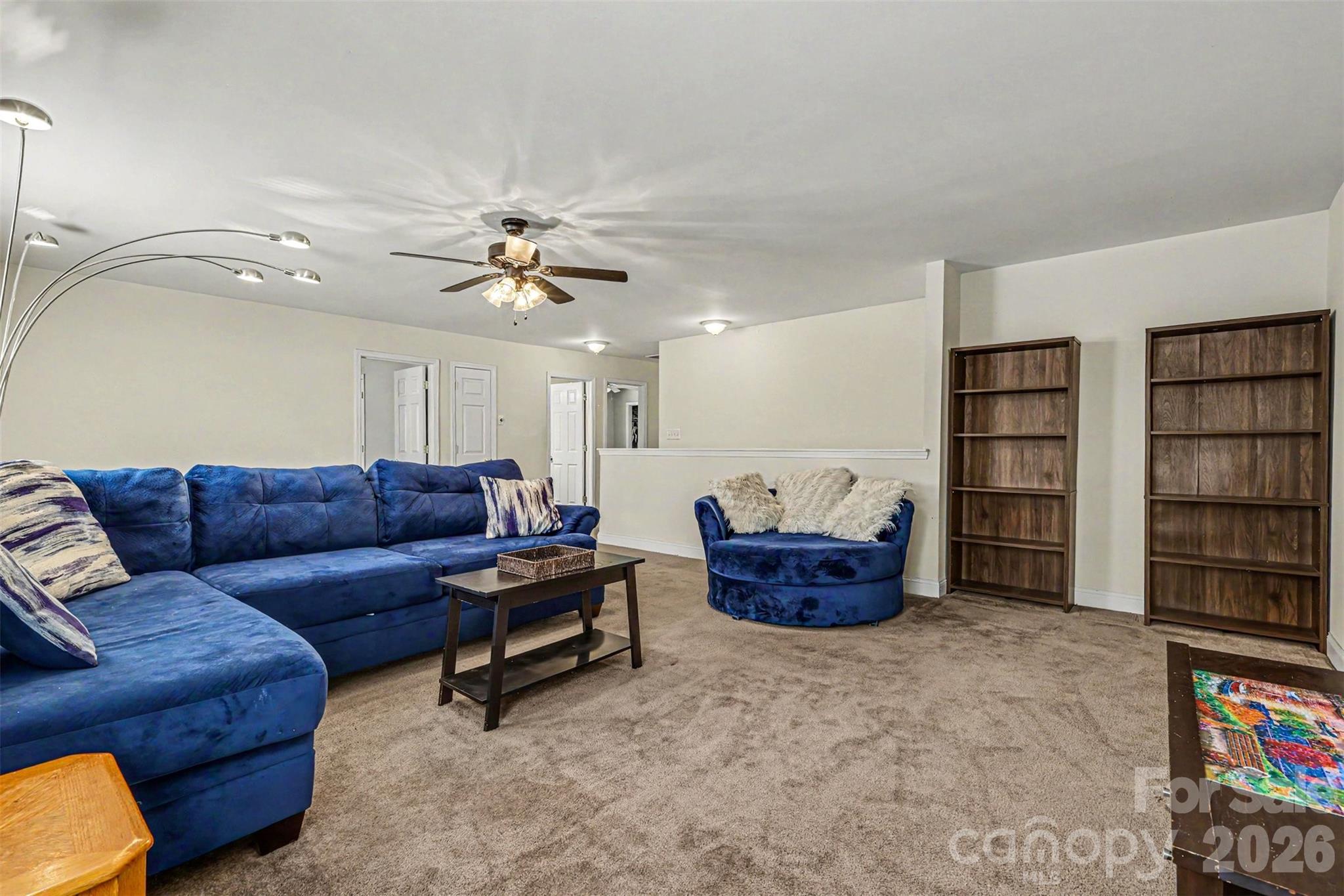 3035 Proverbs Court Monroe, NC 28110 - Photo 15 of 30 a living room with furniture and a bookshelf