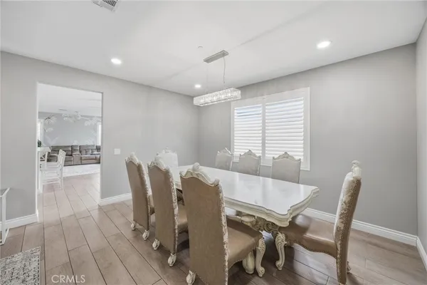 a view of a dining room with furniture and window