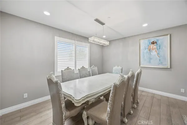 a large kitchen with a table and chairs