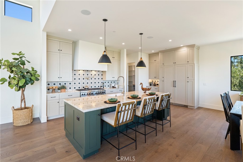 2220 Battering Rock Road Templeton, CA 93465 - Photo 13 of 59 a kitchen with a table chairs sink and cabinets