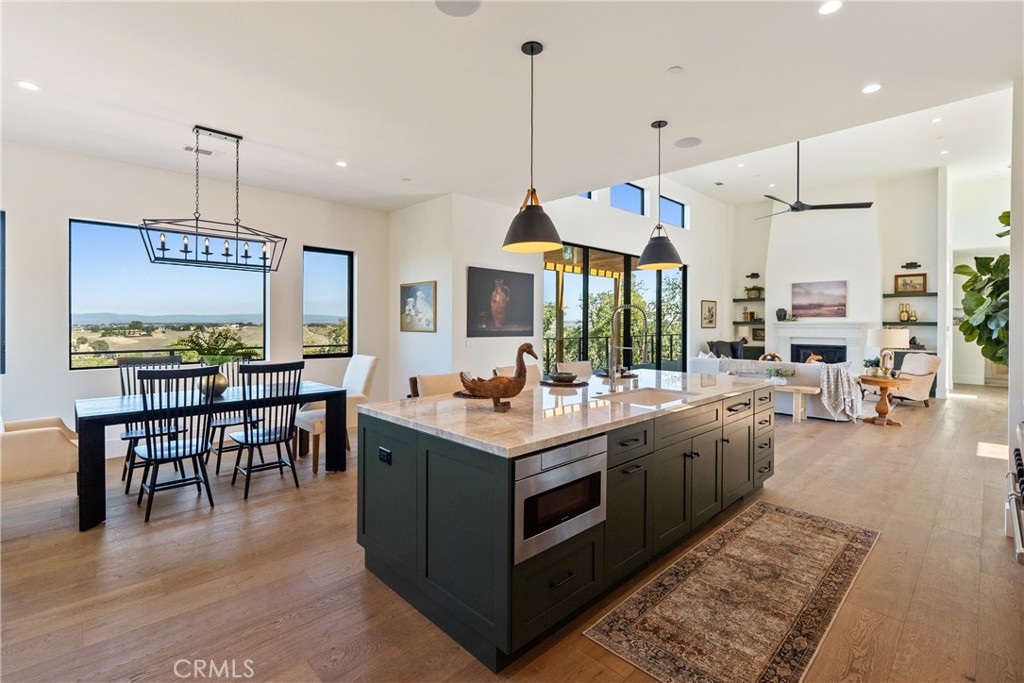 2220 Battering Rock Road Templeton, CA 93465 - Photo 17 of 57 a kitchen with stainless steel appliances granite countertop table chairs and a view of living room